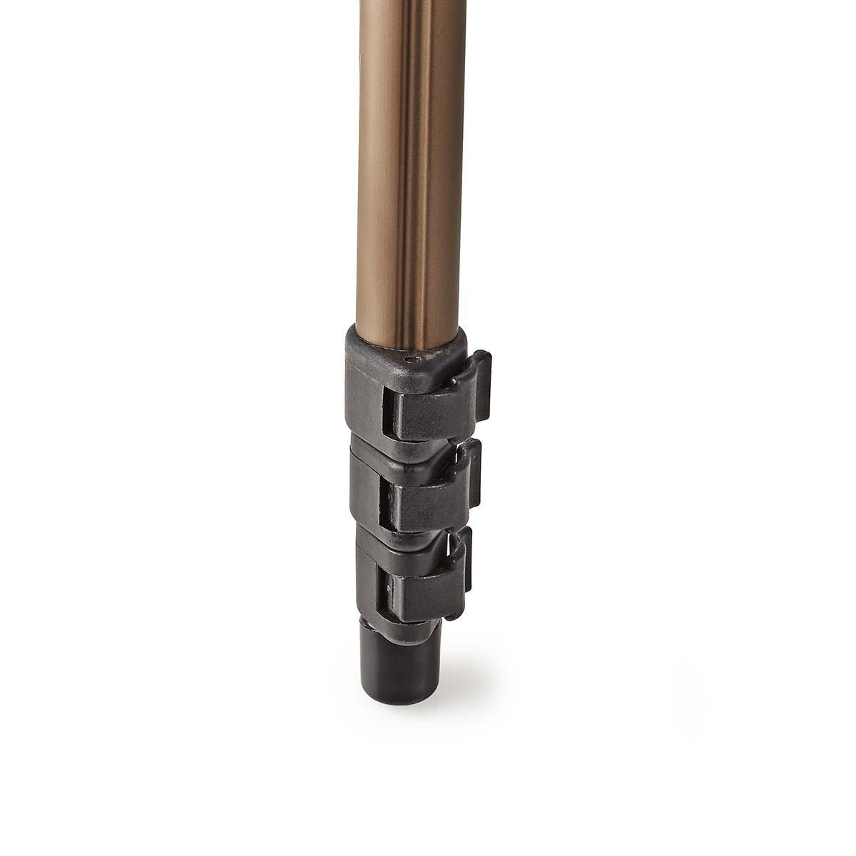 A close-up of a tripod leg with black clips on white background, brown metal leg.