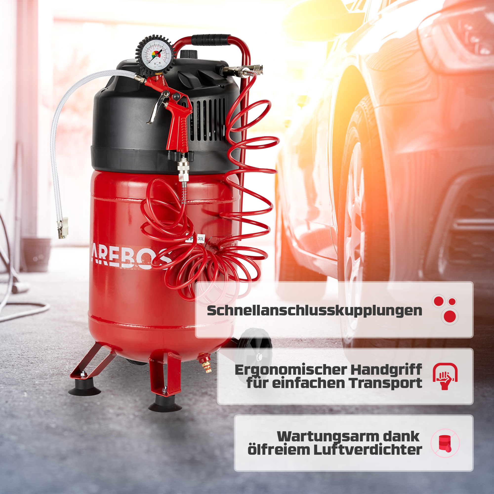 Roter Arebos Luftkompressor. Er ist rot mit schwarzem Oberteil und Manometer. In einer Garage.