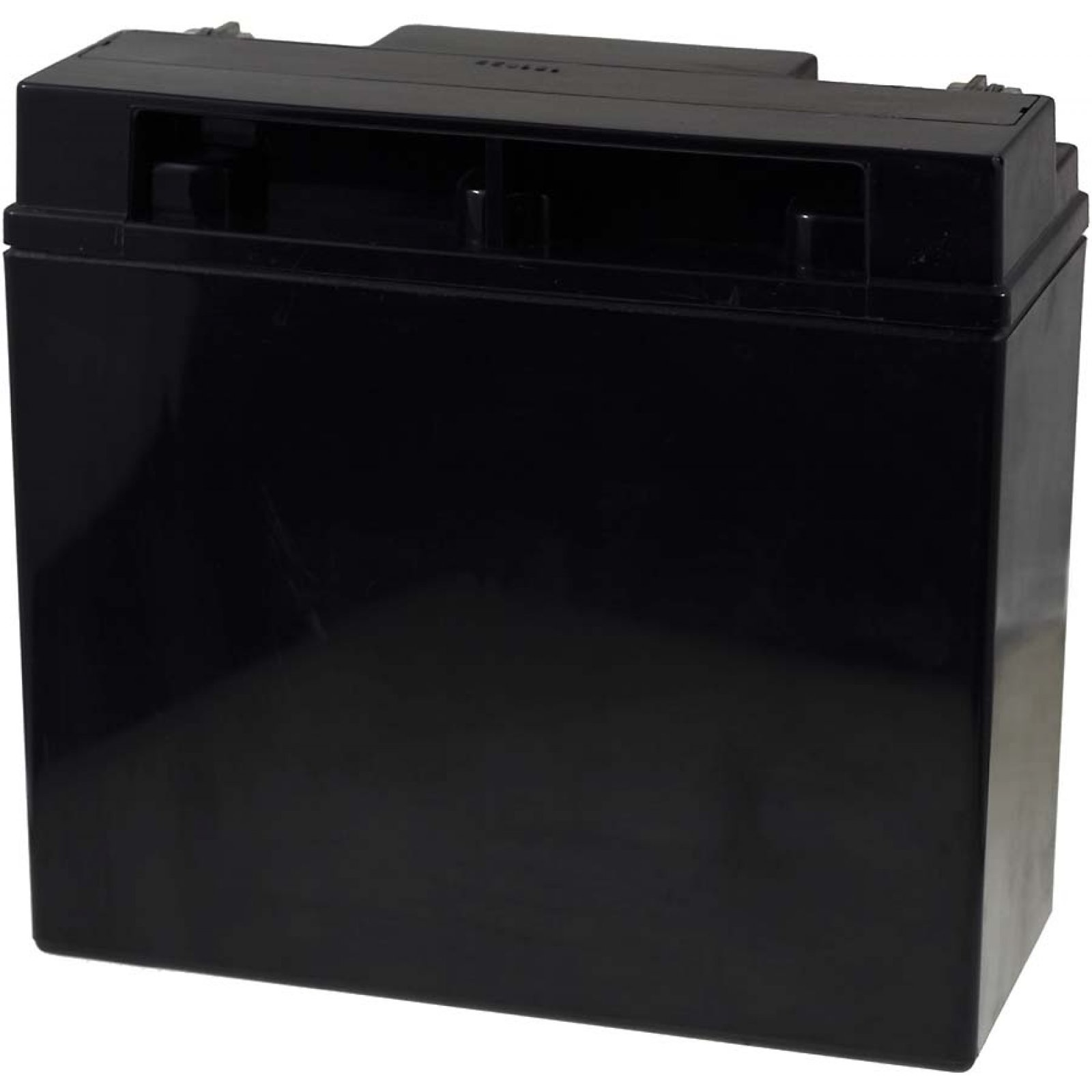 Batería negra con forma rectangular. Tiene algunas ranuras rectangulares en la parte superior.
