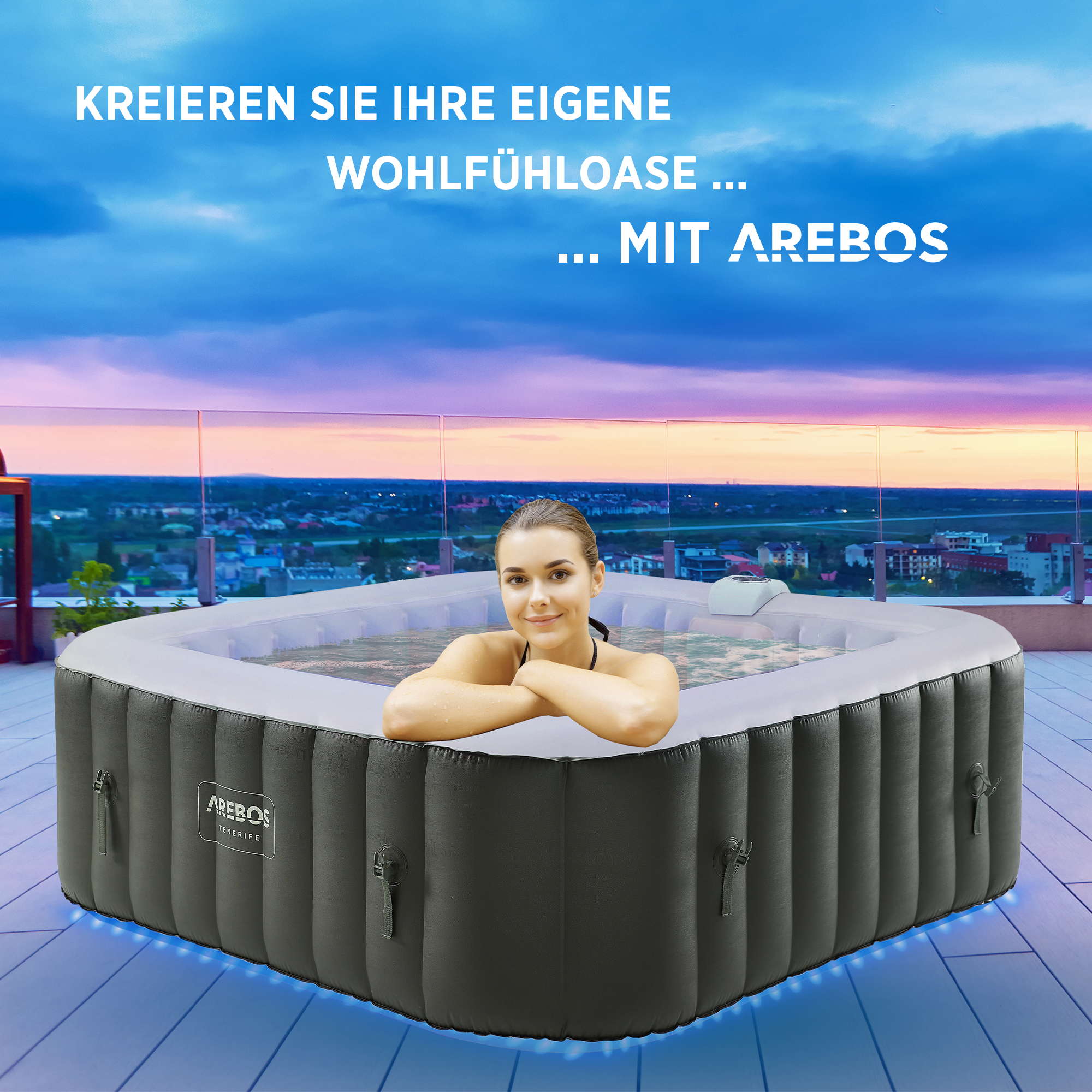 Eine Frau im Whirlpool auf einem Dach mit Skyline im Hintergrund.