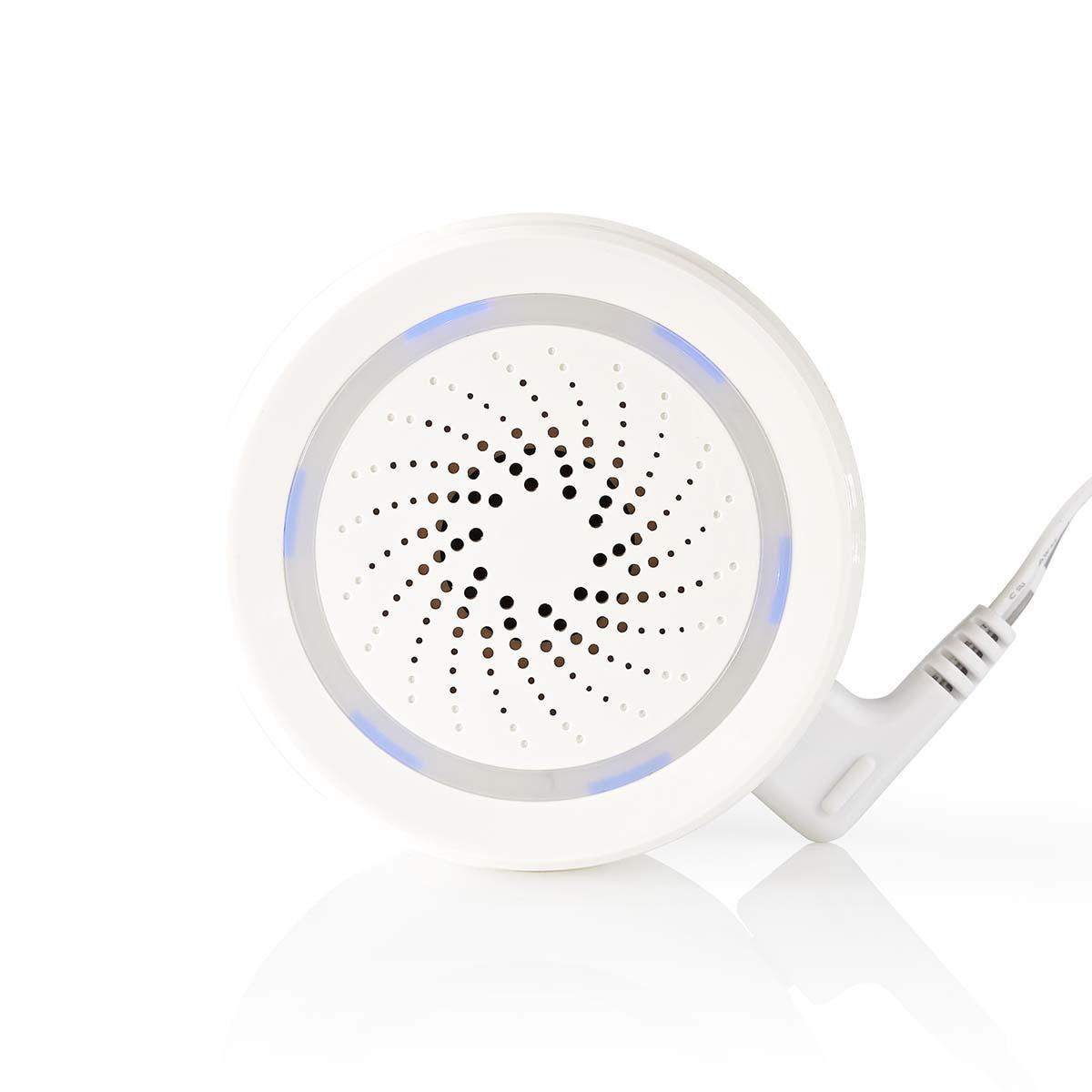 Altavoz redondo blanco con área central oscura e iluminación azul, sobre fondo blanco.