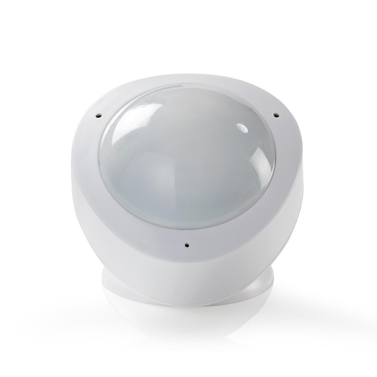 Sensore di movimento bianco con cupola trasparente. Rotondo, con piccoli fori laterali. Isolato su bianco.