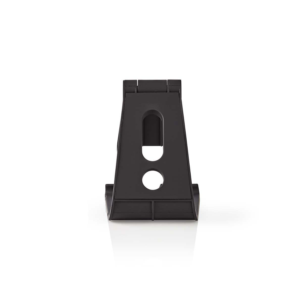 Black phone stand with a hole and two circular holes on a white surface.