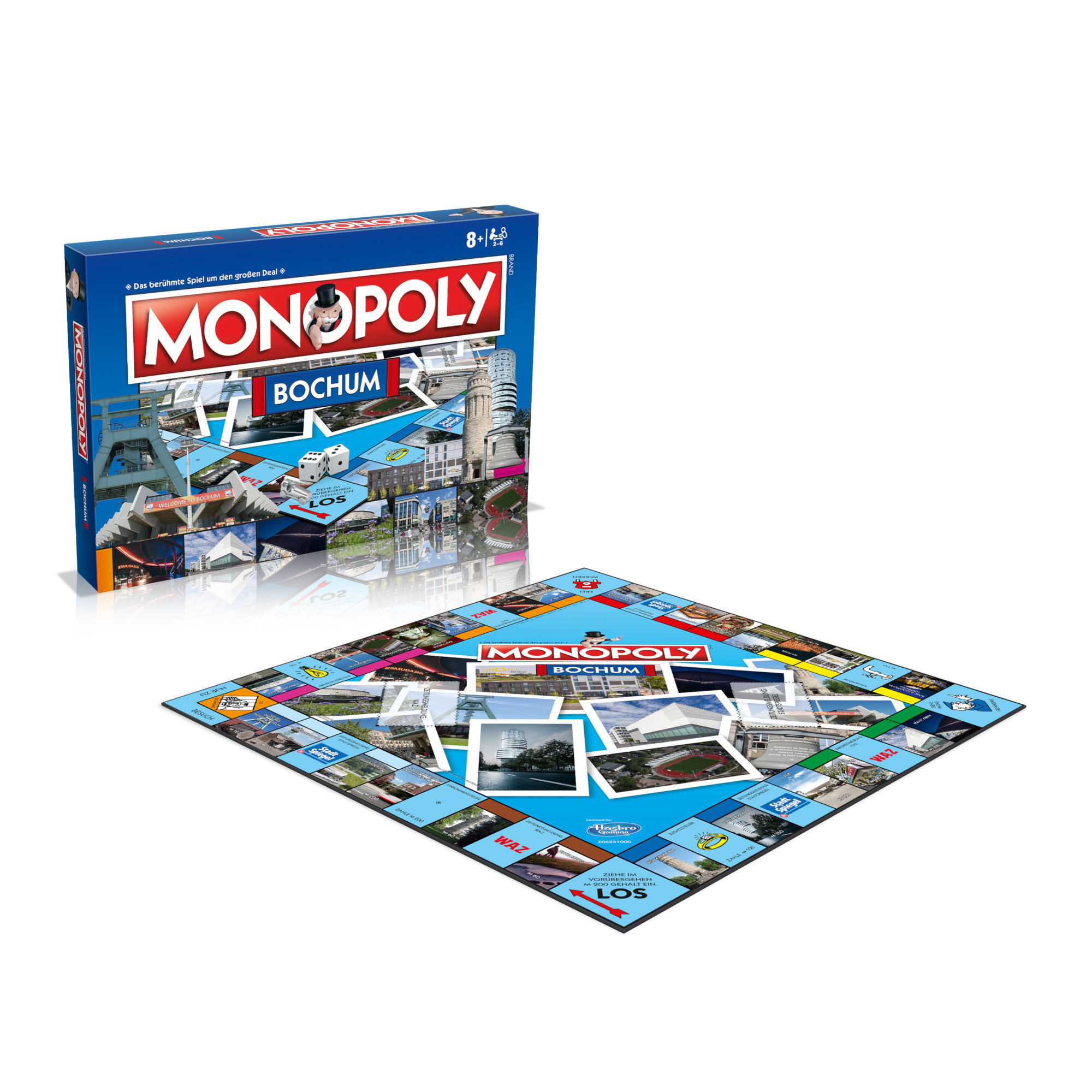 Monopoly-Brettspiel-Box und -Brett. Die Box hat Stadtbilder, das Brett ist offen mit Stadtfotos.
