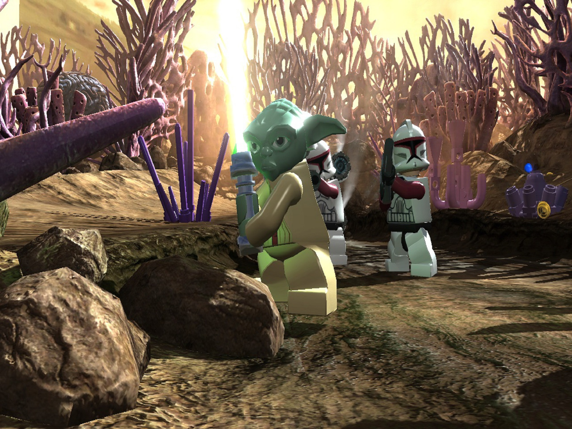 LEGO Yoda mit Lichtschwert, vor Klon-Trupplern, auf brauner Landschaft mit lila Pflanzen.