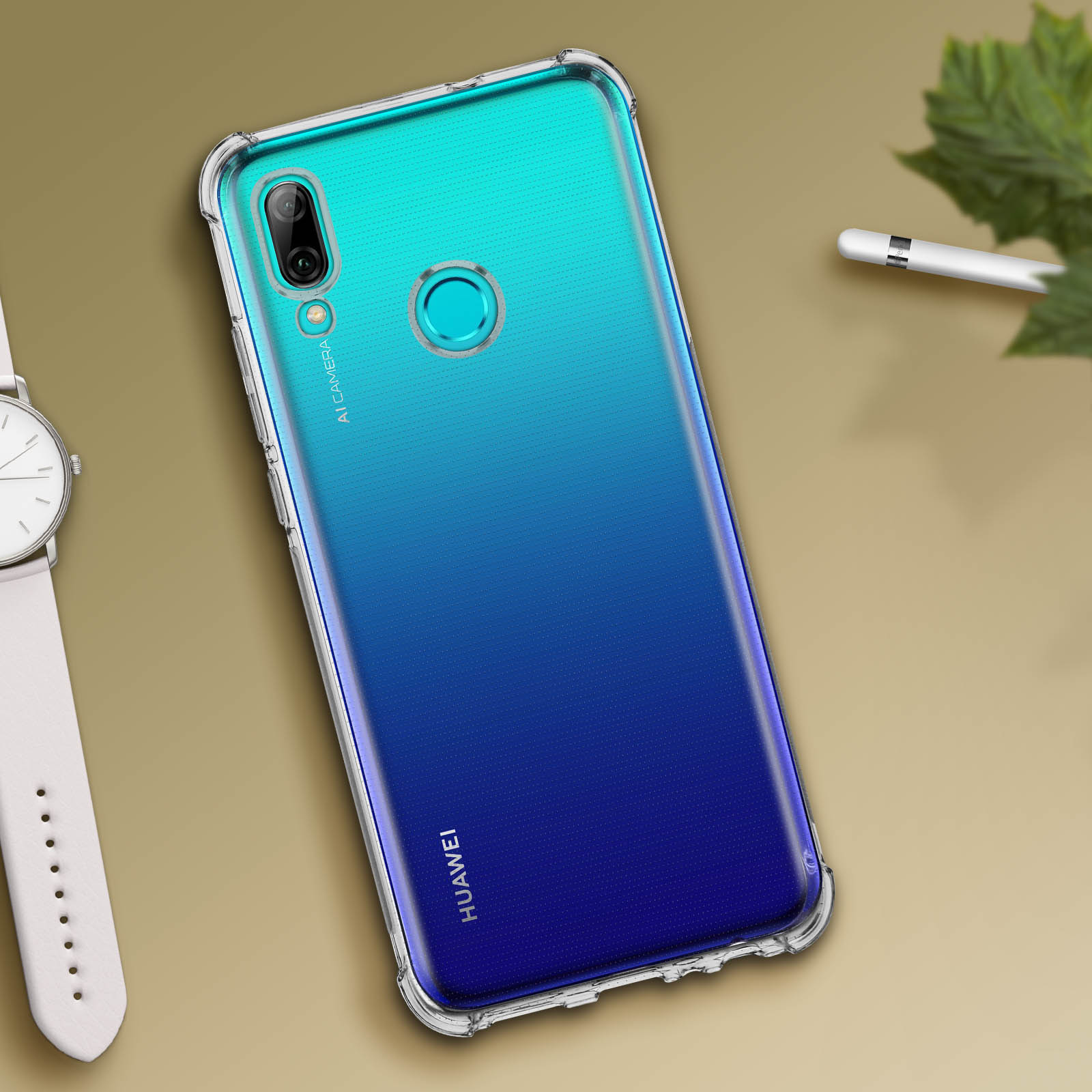 Un telefono in una custodia trasparente con un design blu-verde sfumato. Un orologio e una penna sono visibili.