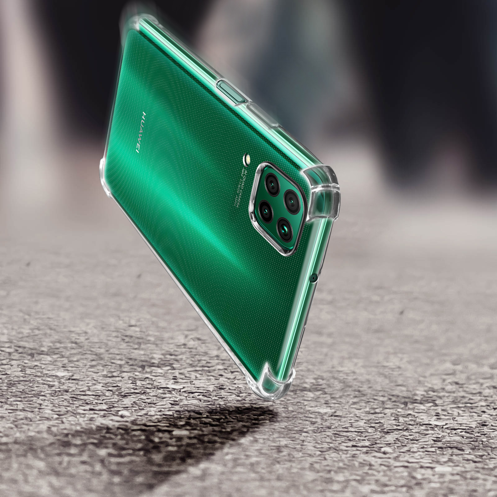 Telefono verde con custodia trasparente. Il telefono è su una superficie strutturata.