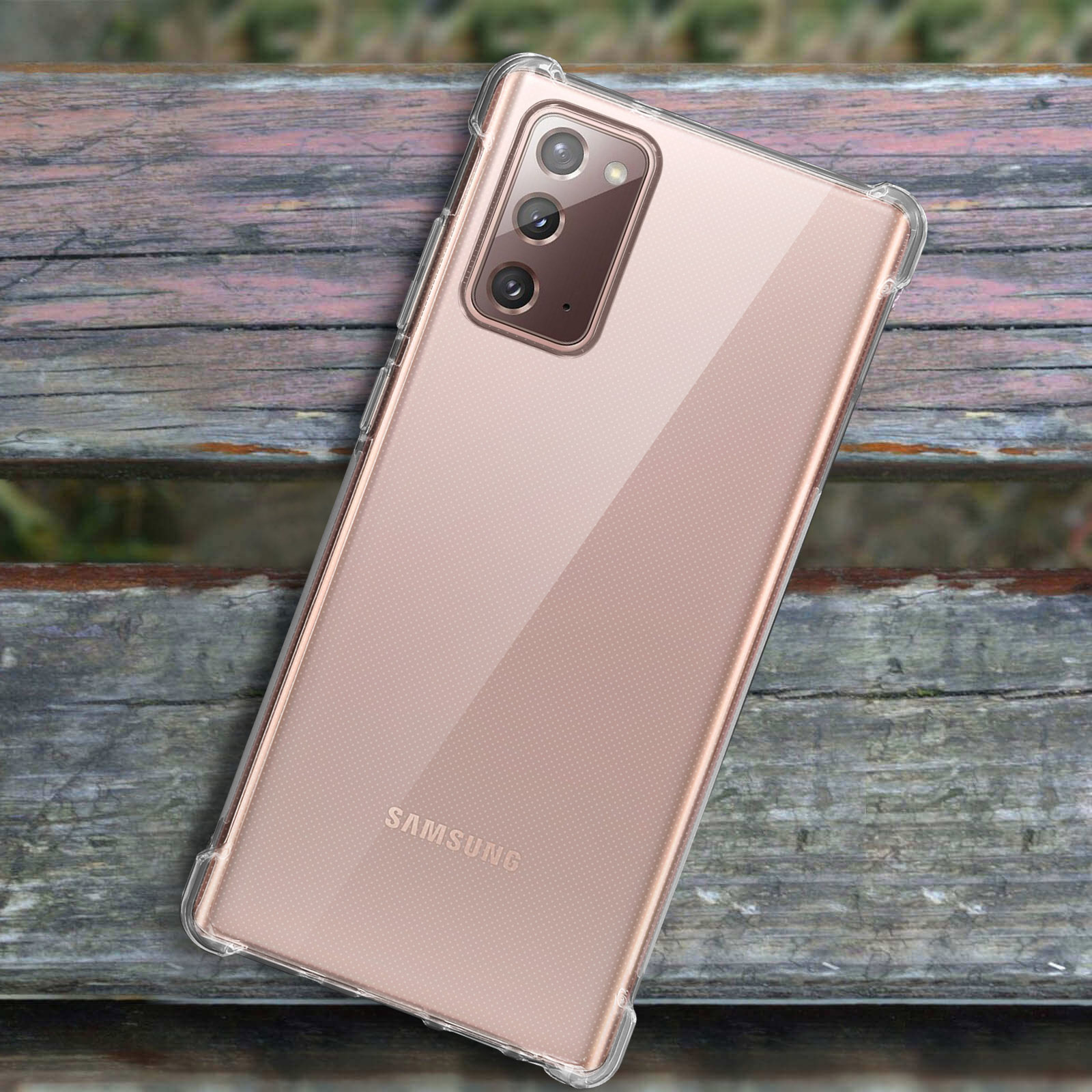 Un telefono in una custodia trasparente, posto su una superficie di legno.