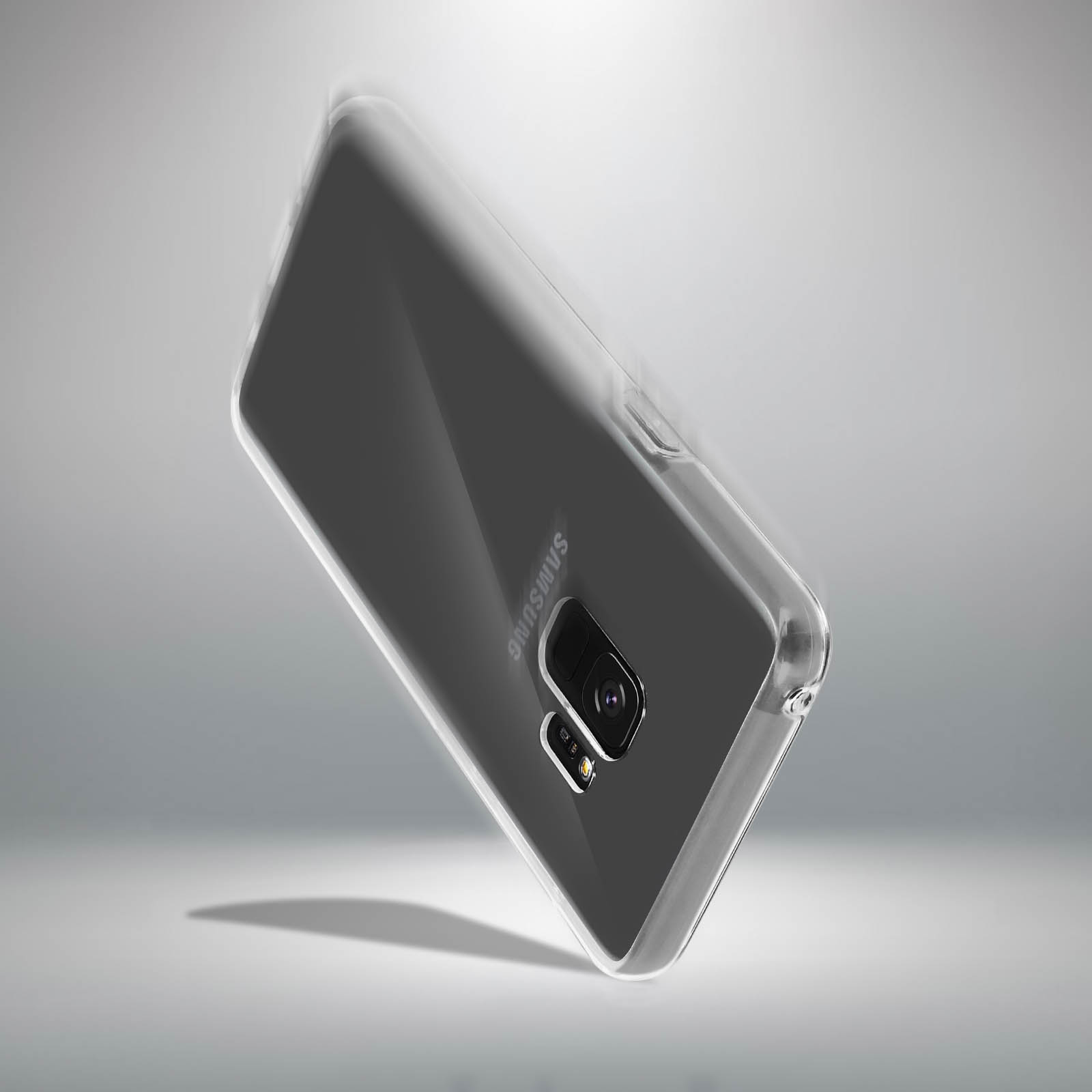 Custodia trasparente con logo Samsung, che evidenzia il modulo fotocamera posteriore su superficie grigia.