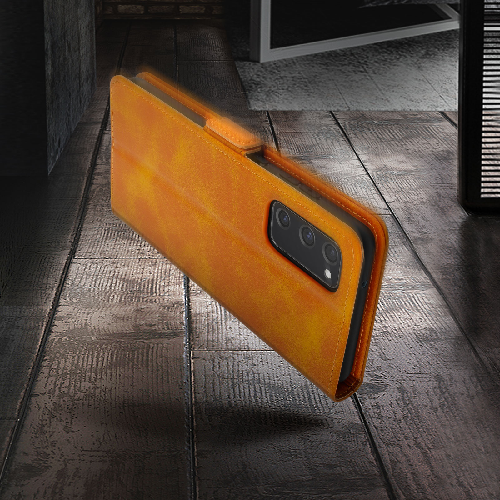 Un étui de téléphone orange ouvert avec un smartphone. L'étui est sur une surface en bois.