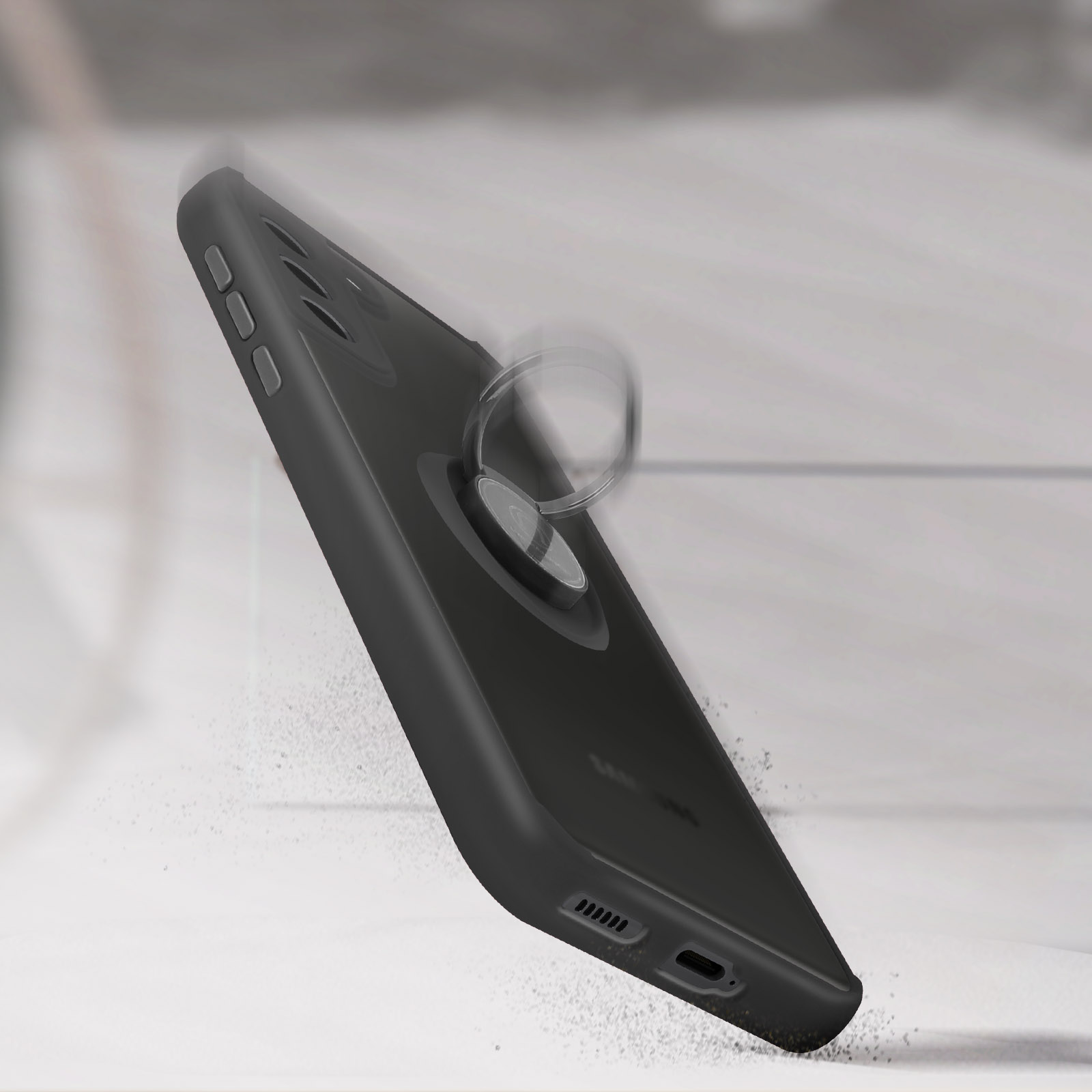 Custodia nera per telefono con anello di supporto. Ci sono particelle di polvere in aria.