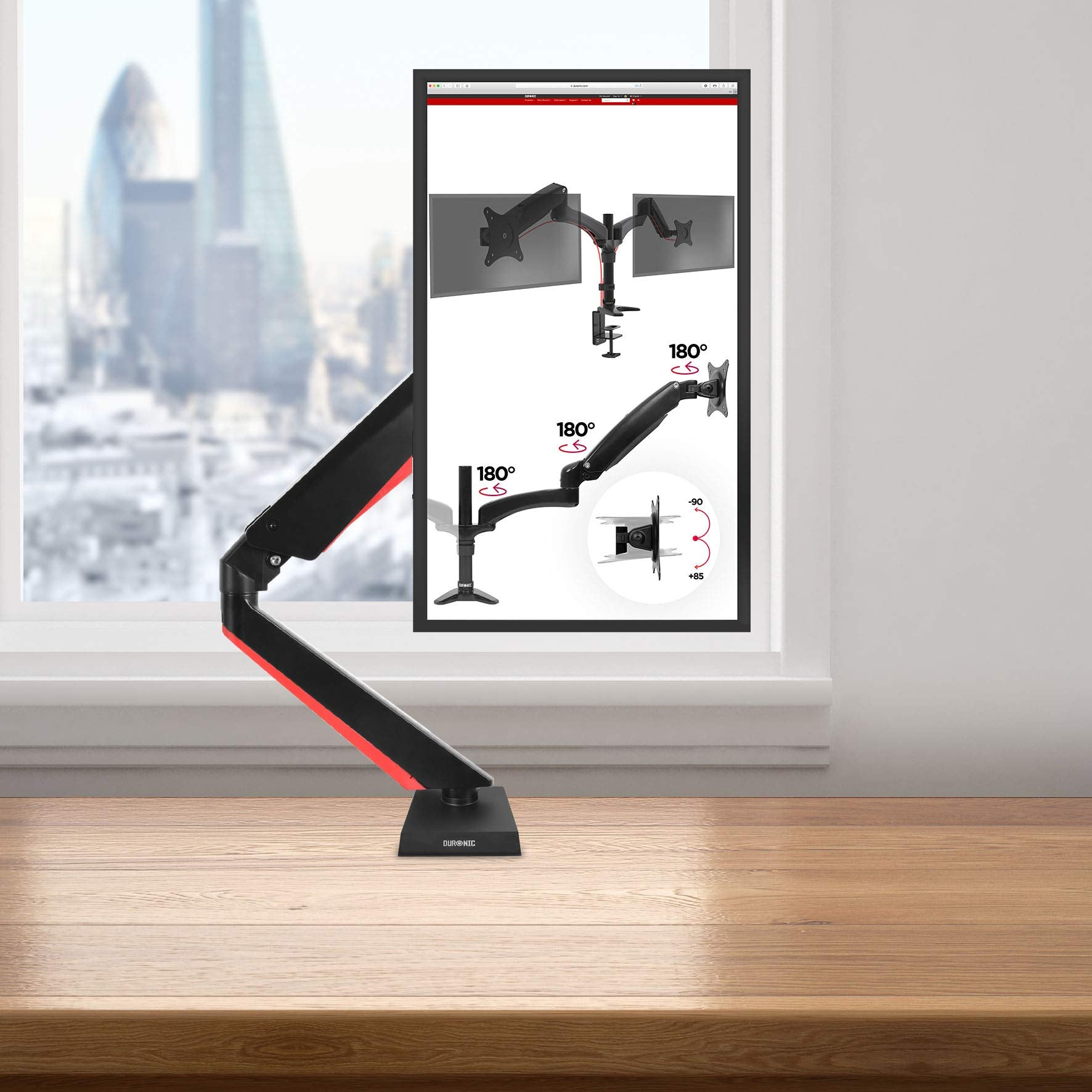 Monitorarm mit zwei Monitoren. Einer zeigt Diagramme der Bewegung des Arms.
