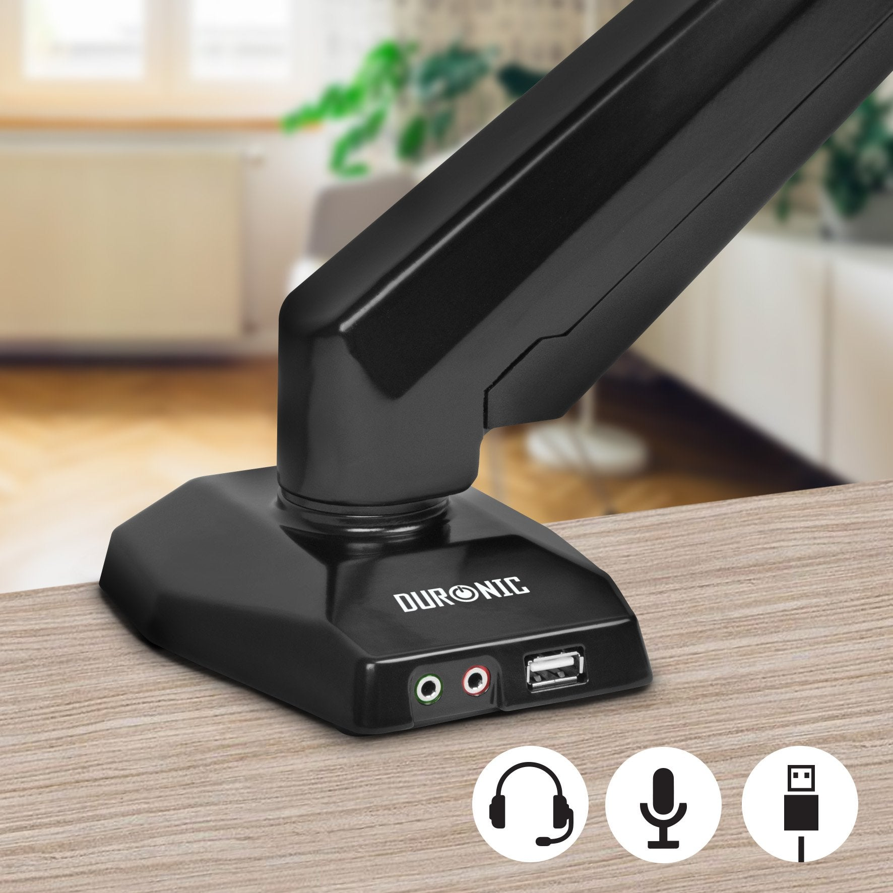 Ein schwarzer Sockel mit Audioanschlüssen und USB-Anschluss. Ein schwarzer Arm erstreckt sich davon. Symbole für Audiogeräte sind unten.