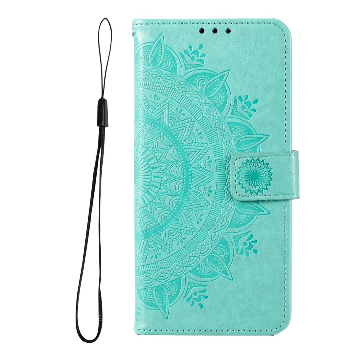 Türkisfarbene Handyhülle mit Mandala-Design, Riemen und Magnetverschluss.