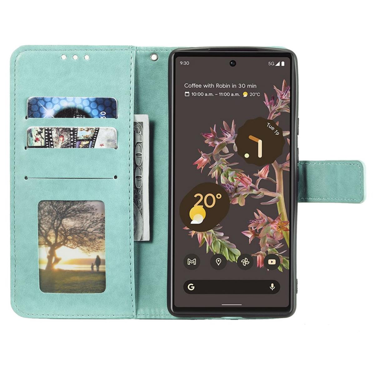 Eine offene Handyhülle mit Telefon. Eine Geldbörse und Kreditkarten befinden sich im Inneren.
