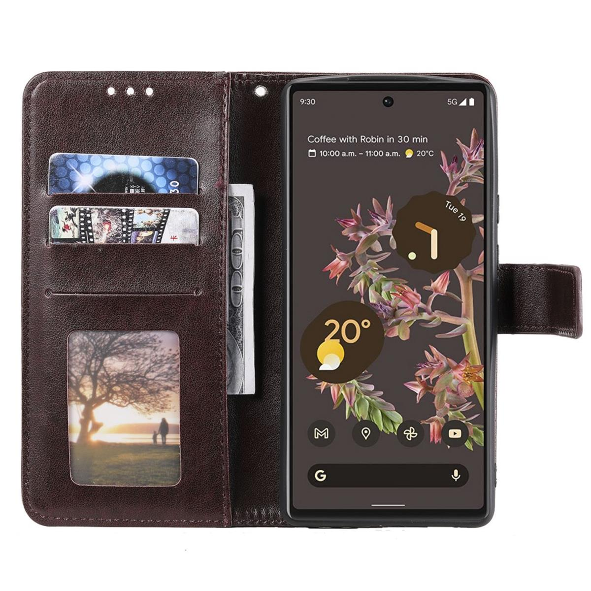 Geöffnete Handyhülle mit Telefon, das Zeit und Datum anzeigt. Auch Karten und Bargeld sichtbar.