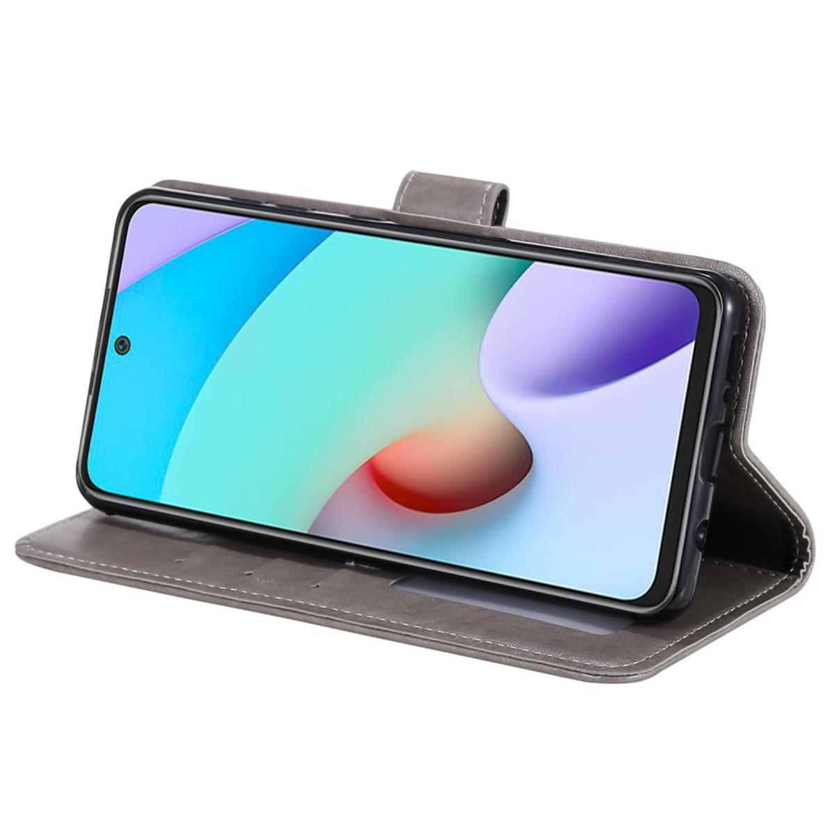 Telefon in grauem Etui, geöffnet. Der Bildschirm zeigt bunte abstrakte Kunst.