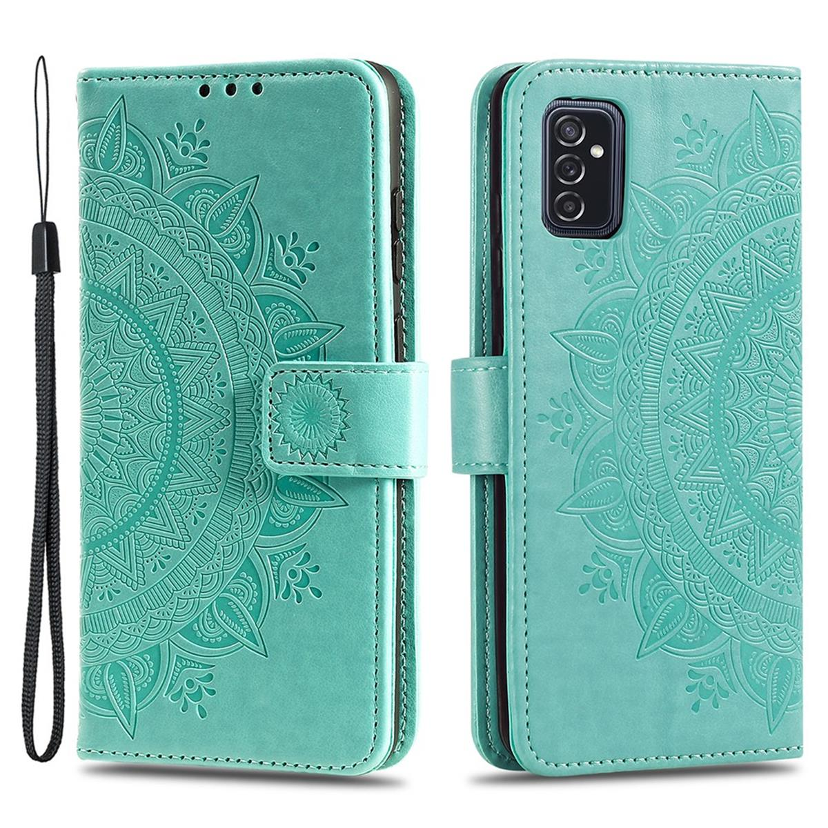 Eine teal-farbene Leder-Handyhülle mit Mandala-Design, geöffnet, um das Innere zu zeigen.