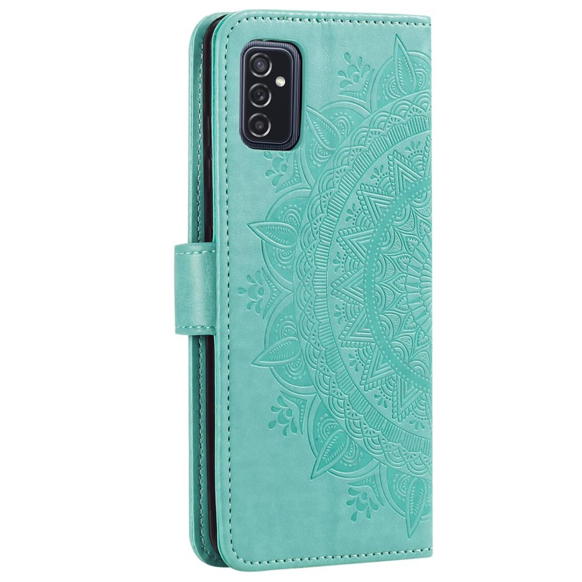 Eine türkisfarbene Handyhülle mit einem dekorativen Mandala-Design. Die Hülle ist geöffnet und zeigt das Innere des Telefons.