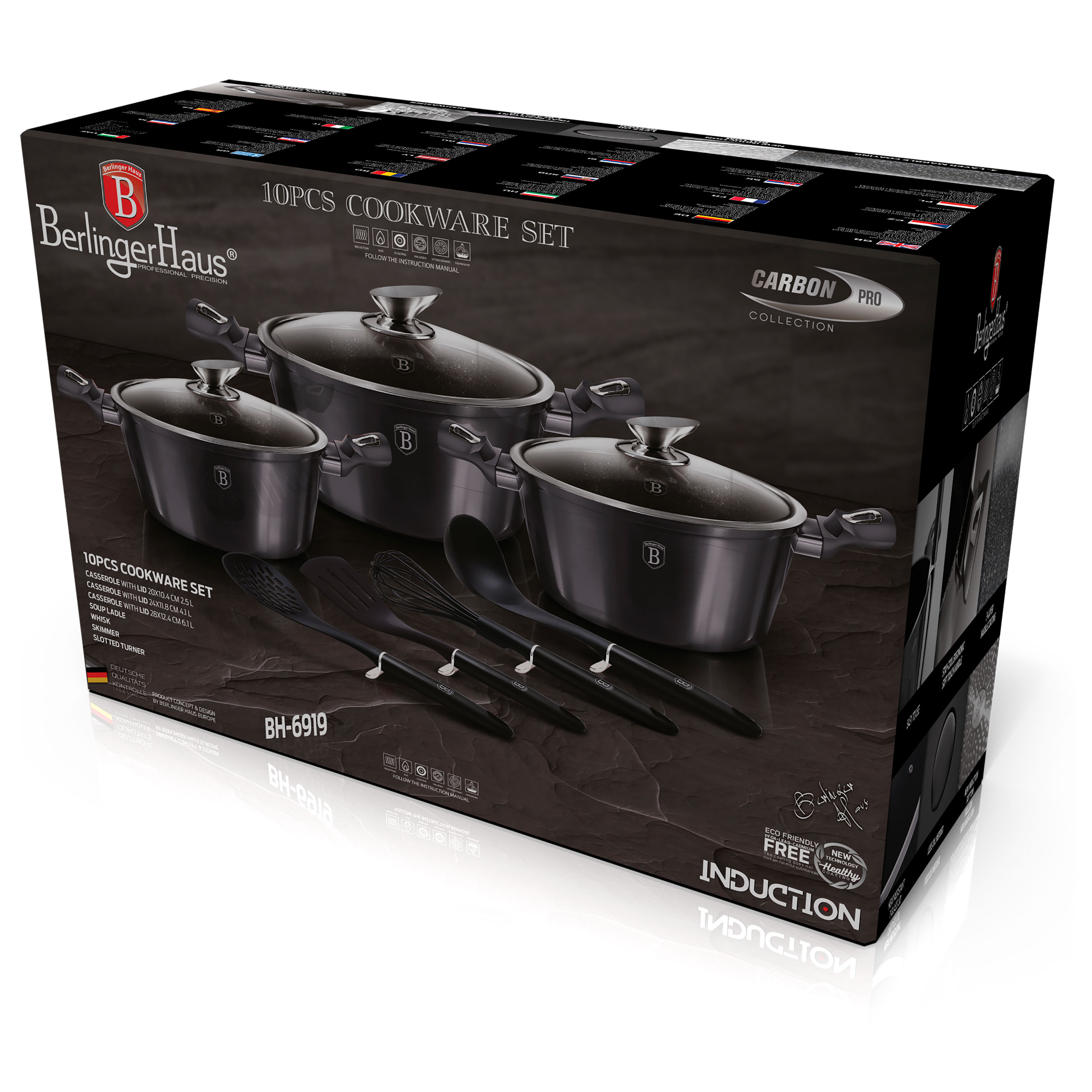 Juego de utensilios de cocina en una caja. Ollas y sartenes negras con tapas y utensilios negros.