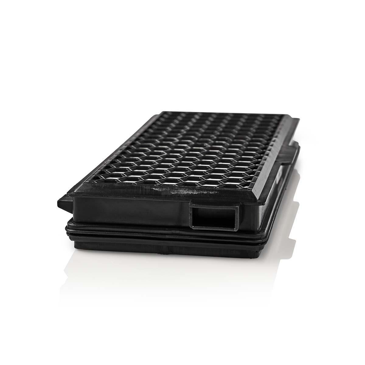 A black rectangular grate with a honeycomb pattern sits on a white surface.