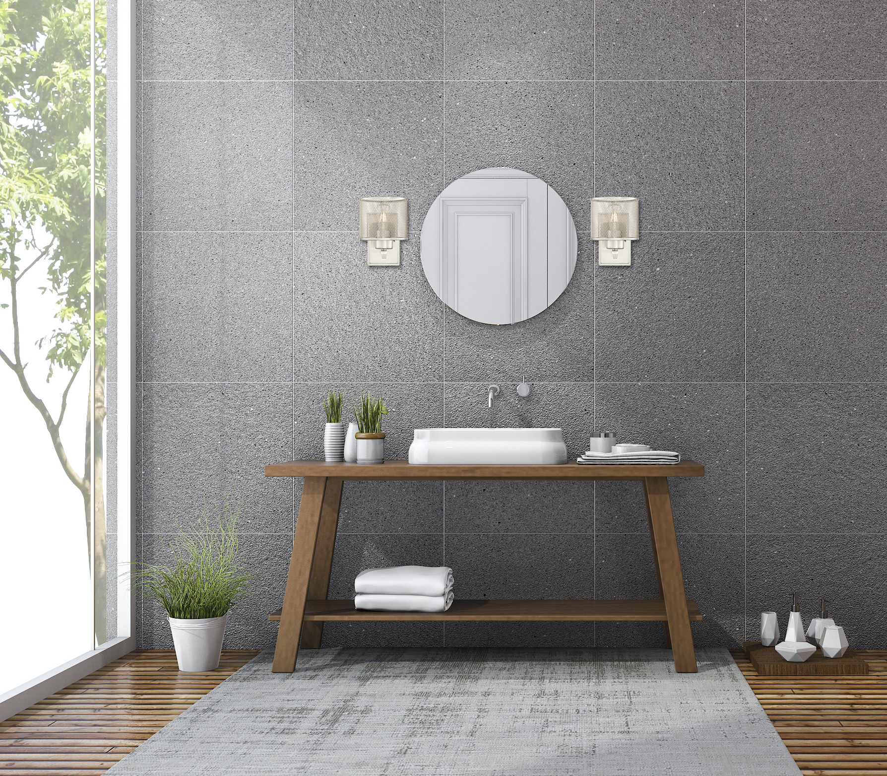 Badezimmer mit hölzernem Waschtisch, rundem Spiegel, weißem Waschbecken und grauen Fliesen an Wand und Boden.