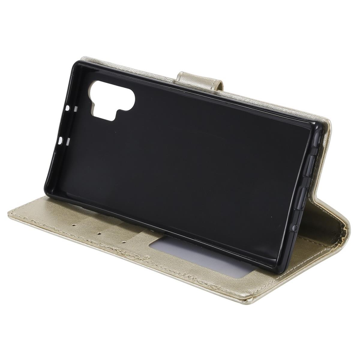 Goldene Handyhülle offen, mit schwarzem Telefonhalter.