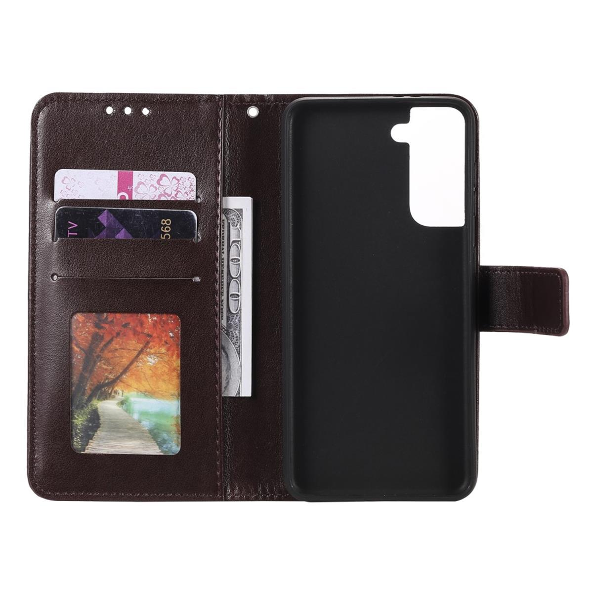 Geöffnete Handyhülle mit Karten, Geld und einem Telefon. Braune Lederhülle.