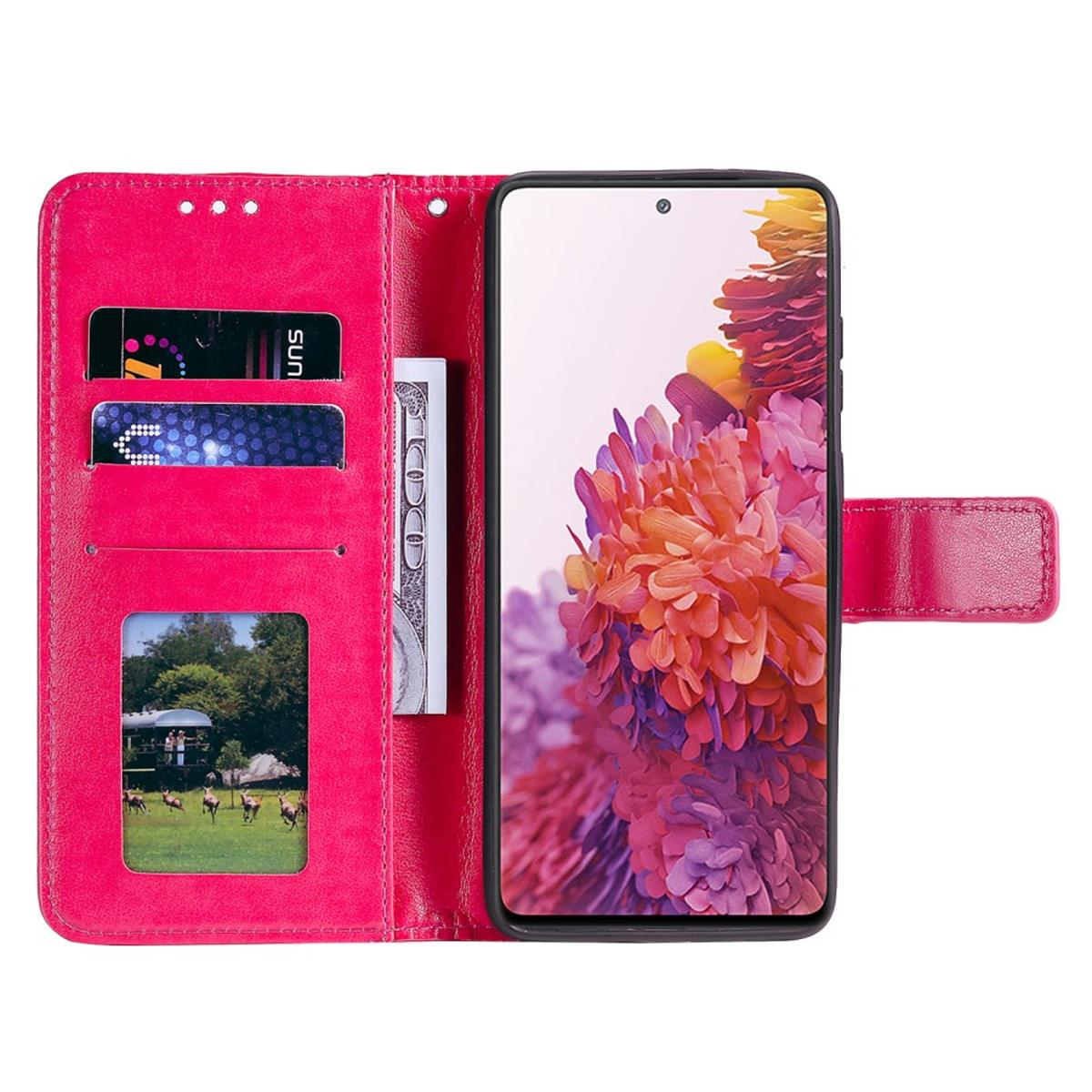 Eine pinkfarbene Handyhülle ist geöffnet und zeigt ein Telefon, Karten und Geld. Die Hülle hat ein Bild von Hirschen.