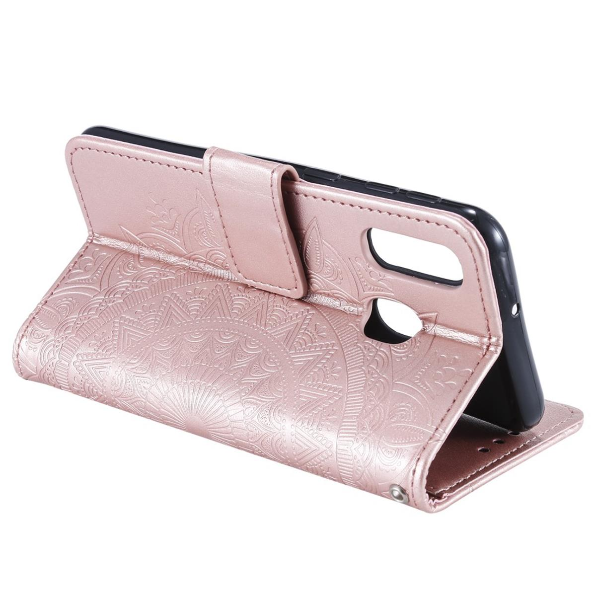 Roségoldene Handyhülle mit Mandala-Design, offen, mit schwarzem Telefon.