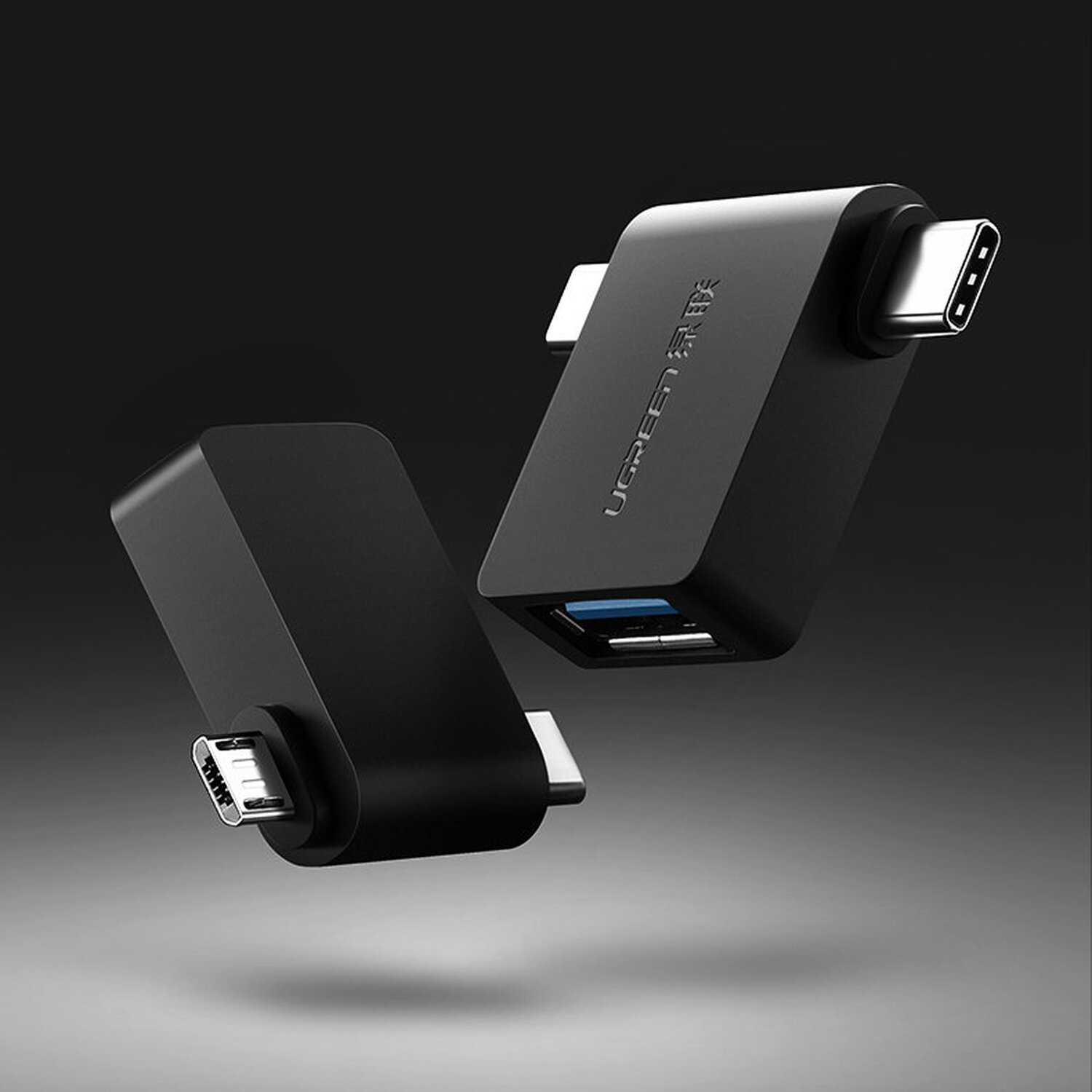 Schwarze USB-C-zu-USB-A-Adapter, zwei, mit dem UGREEN-Logo, vor dunklem Hintergrund.