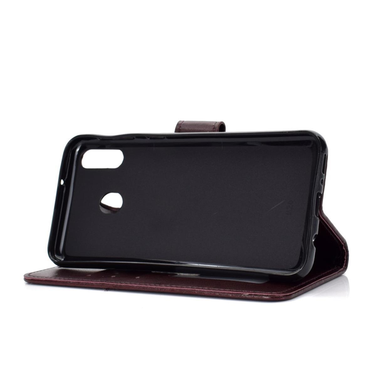 Eine offene braune Handyhülle mit schwarzem Telefonhalter.