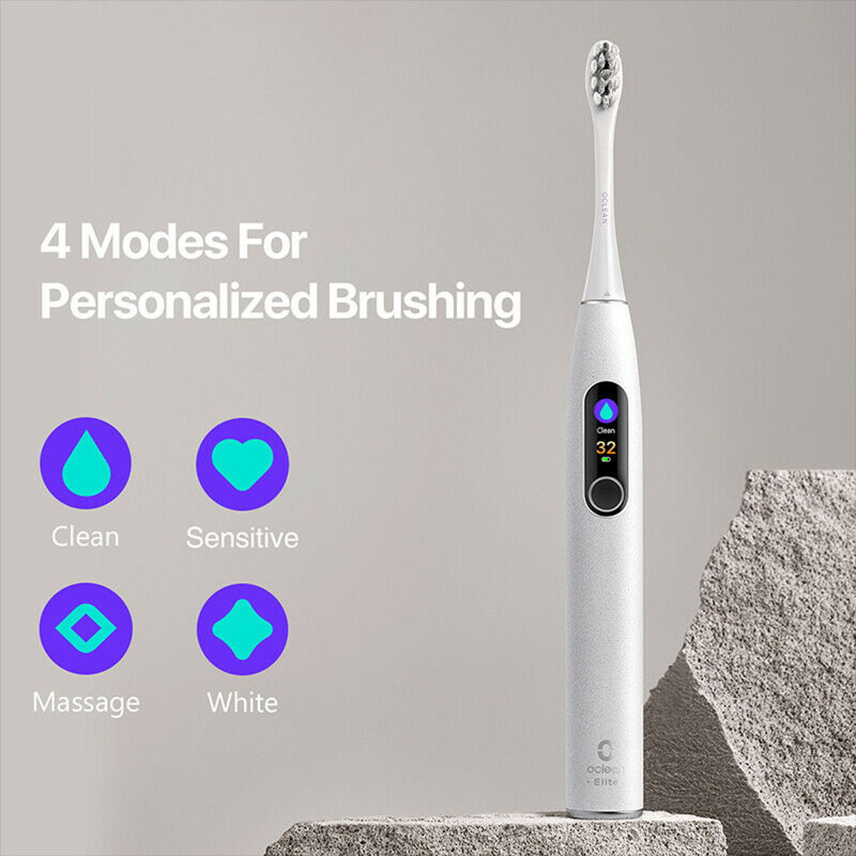 Biała elektryczna szczoteczka do zębów z 4 trybami. Wyświetlacz pokazuje timer. Szare kamienne tło.