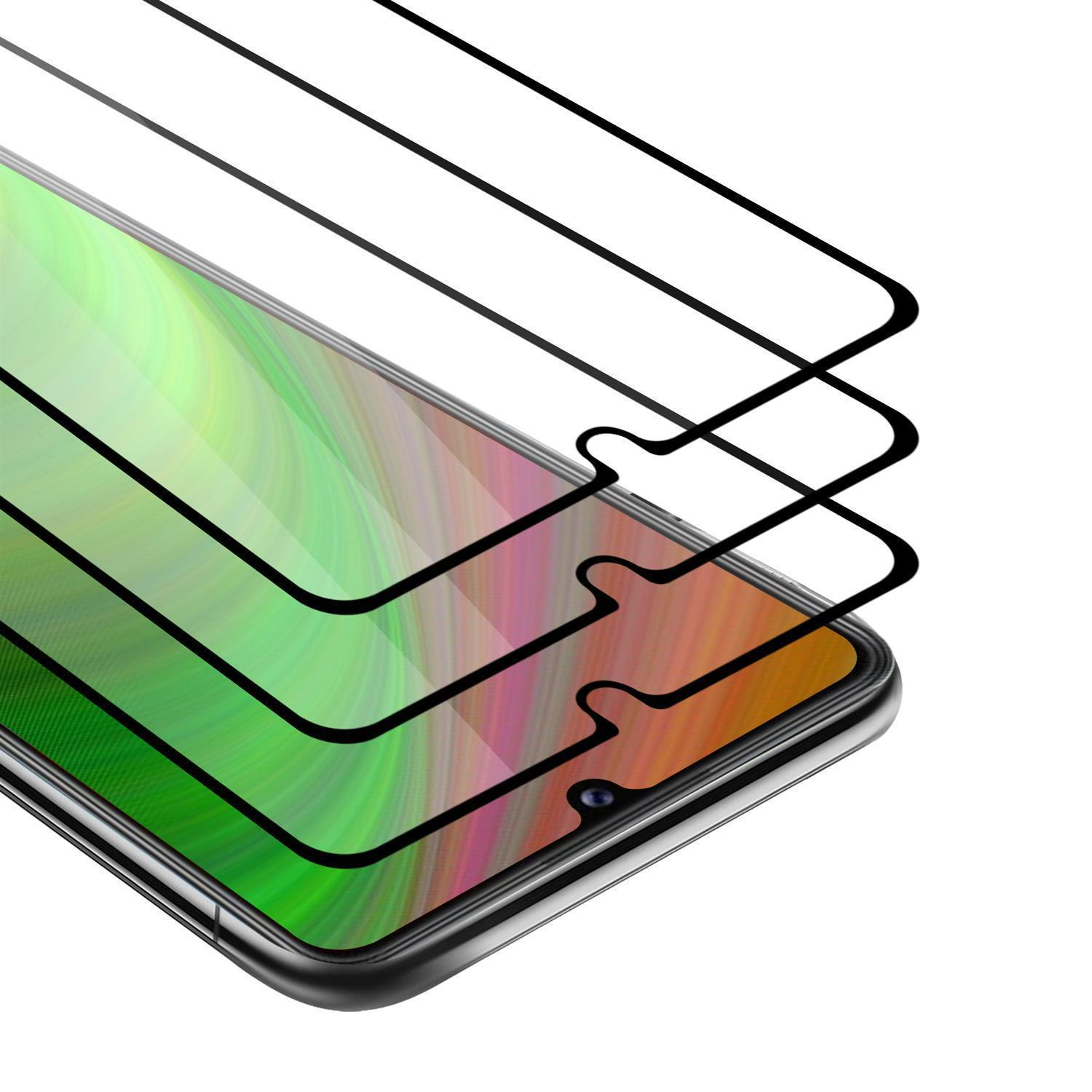 Un telefono con tre protezioni per lo schermo, sovrapposte. Lo schermo mostra uno sfondo colorato.