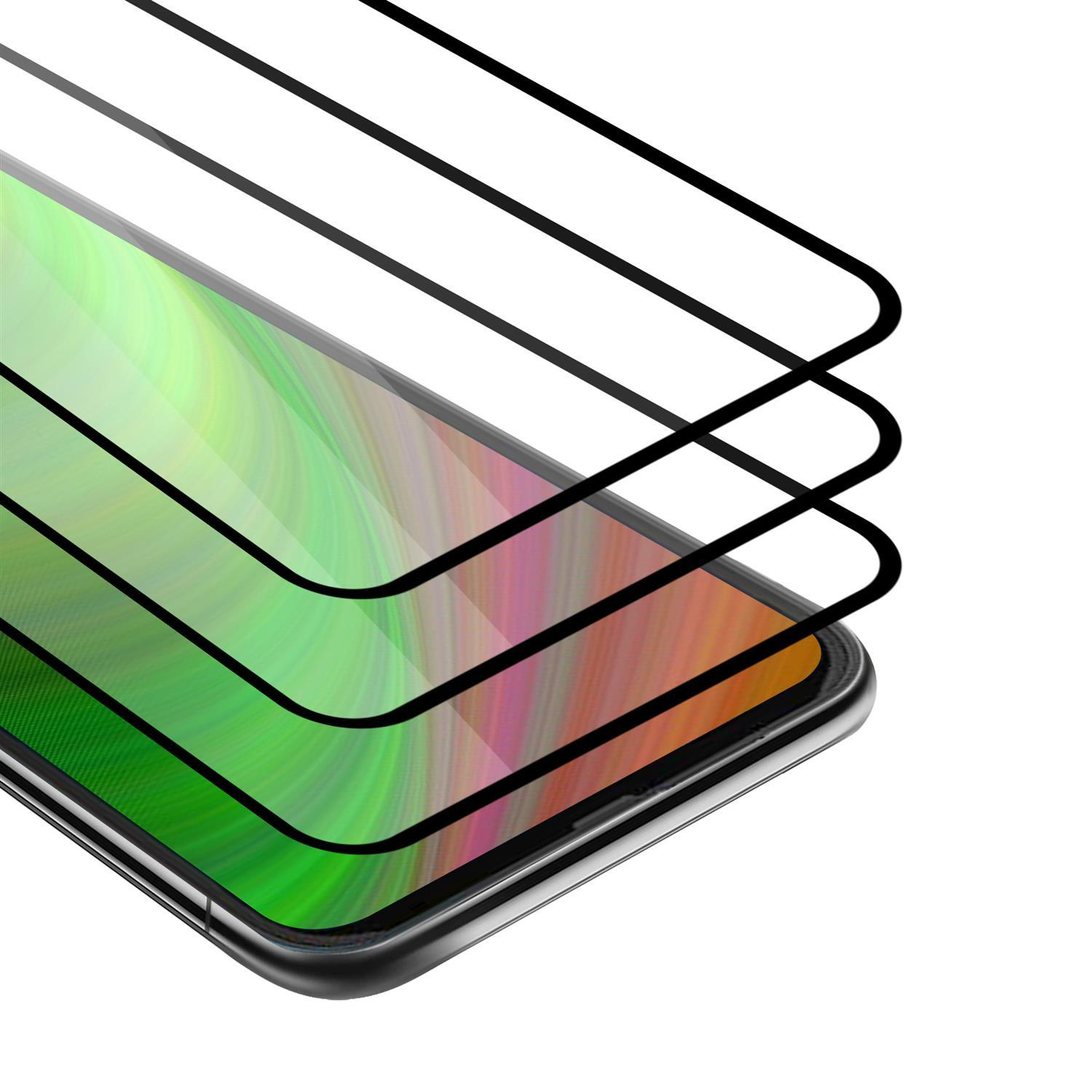 Uno smartphone con uno schermo dai toni verdi coperto da tre strati protettivi, su uno sfondo bianco.