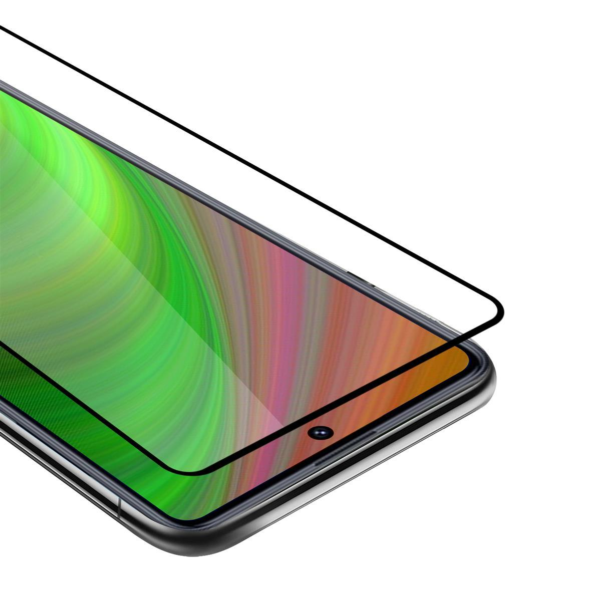 Protezione schermo applicata su un telefono. Lo schermo mostra un'immagine colorata.
