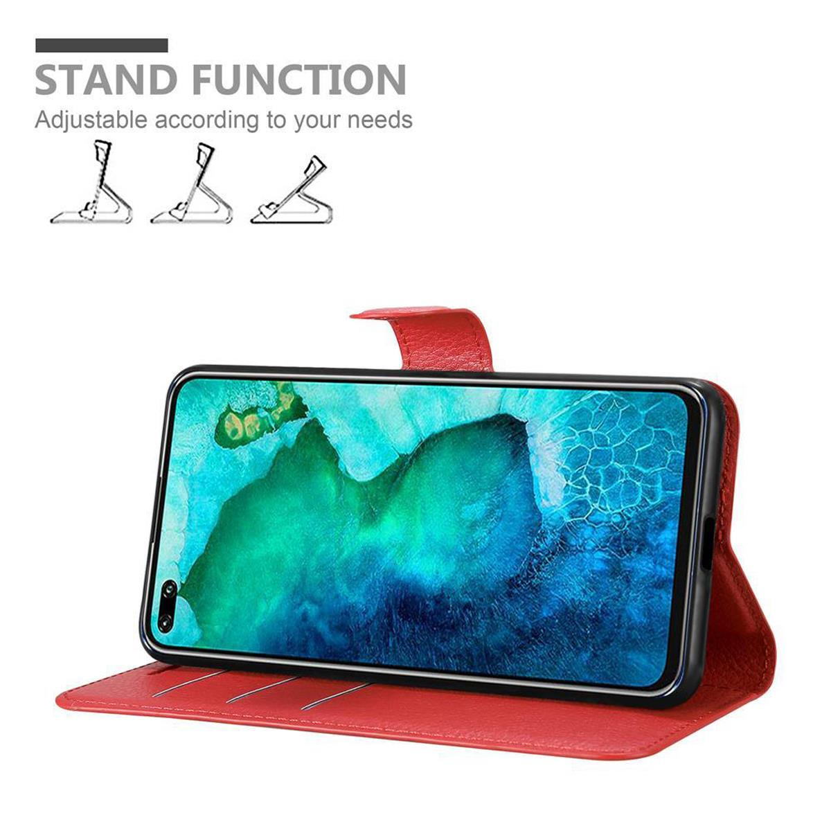Eine rote Handyhülle mit einem Telefon darin ist geöffnet. Das Telefon ist aufgestellt und zeigt einen Bildschirm. Text: 'STAND FUNCTION'.