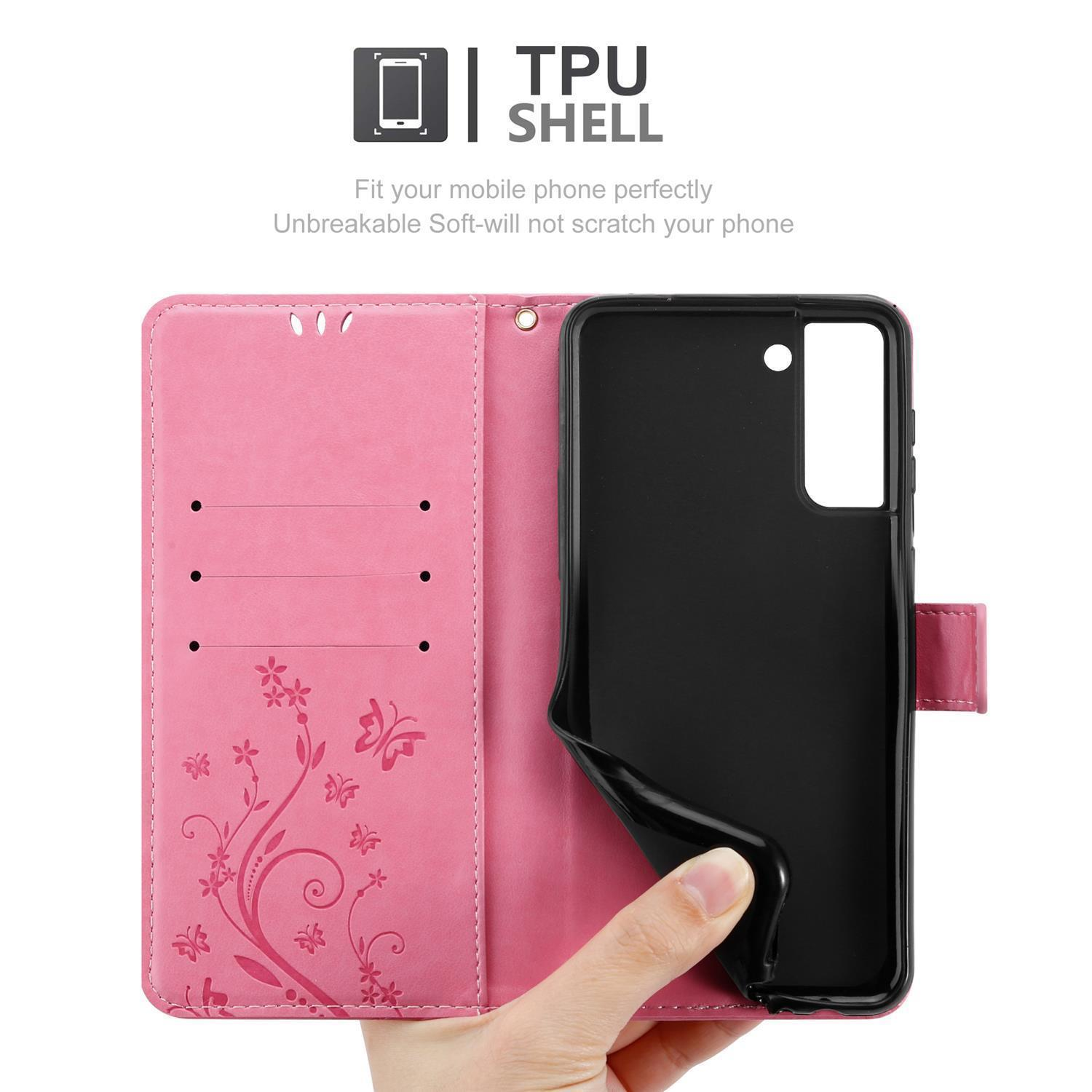 Custodia del telefono rosa aperta. Un telefono nero è visibile. Farfalle e design floreale sulla custodia.