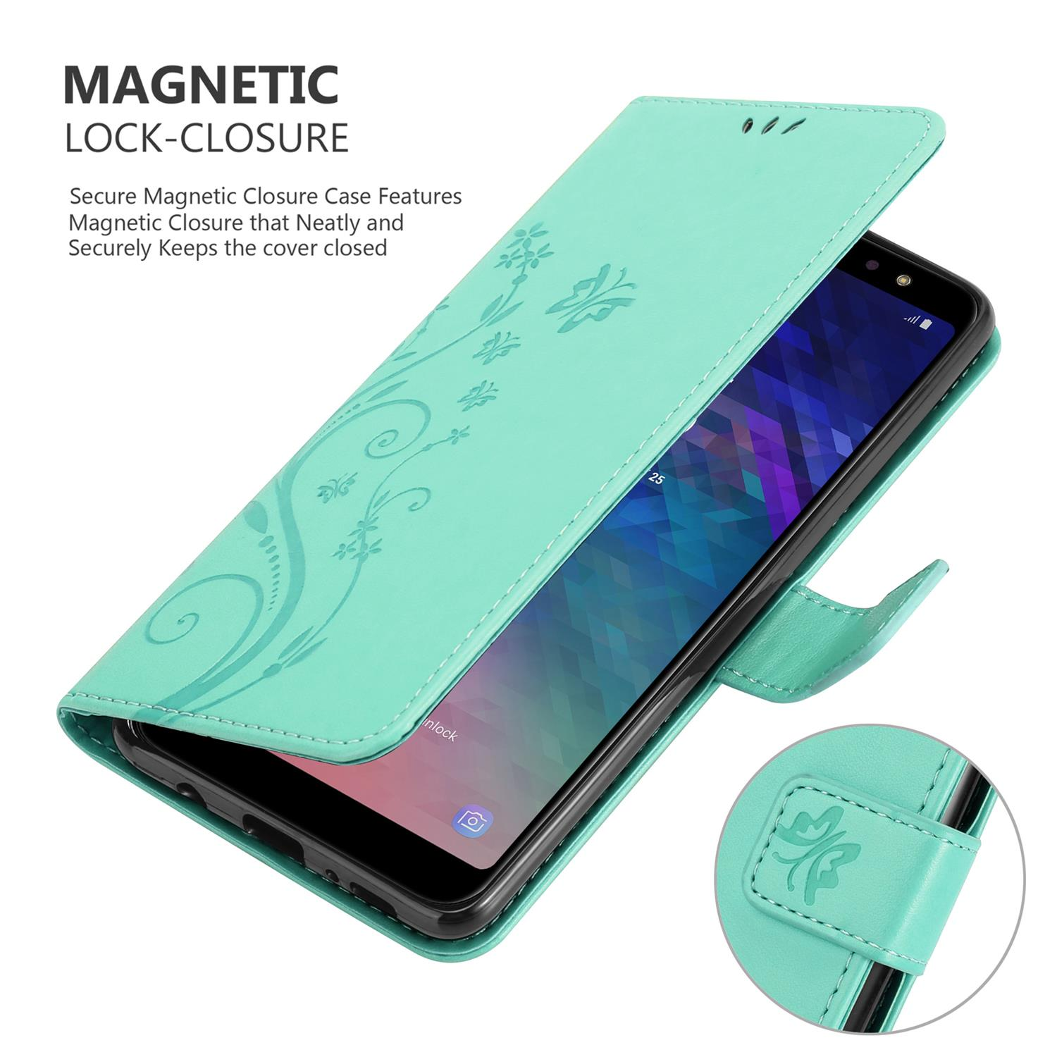 Un telefono in una custodia verde menta, con un design floreale. La custodia ha una chiusura magnetica. Il telefono è acceso.