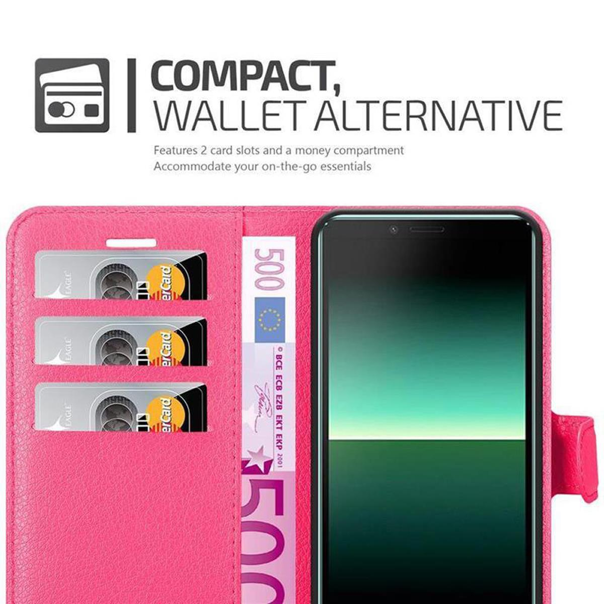 Custodia rosa aperta, mostra telefono, slot per carte e denaro. Portafoglio compatto.