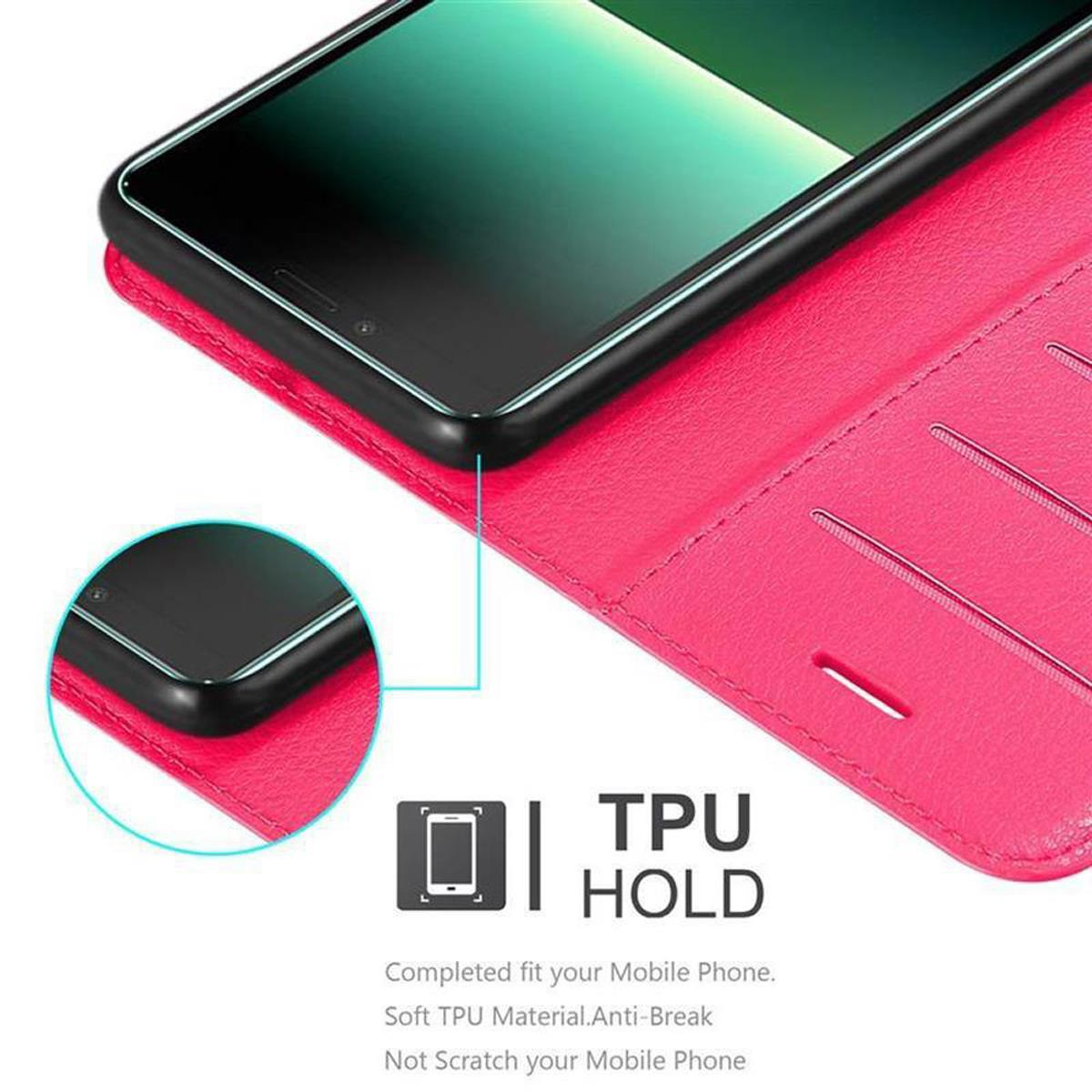 Smartphone in una custodia rosa, con un logo TPU HOLD. La custodia è aperta, mostrando il telefono all'interno.