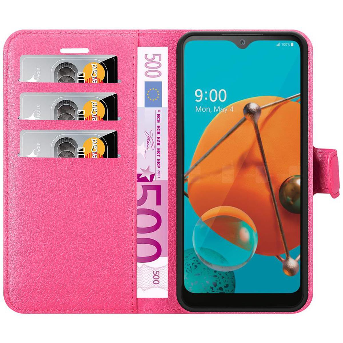 Custodia per telefono rosa, aperta, con banconote e carte di credito all'interno e un telefono con sfondo colorato.