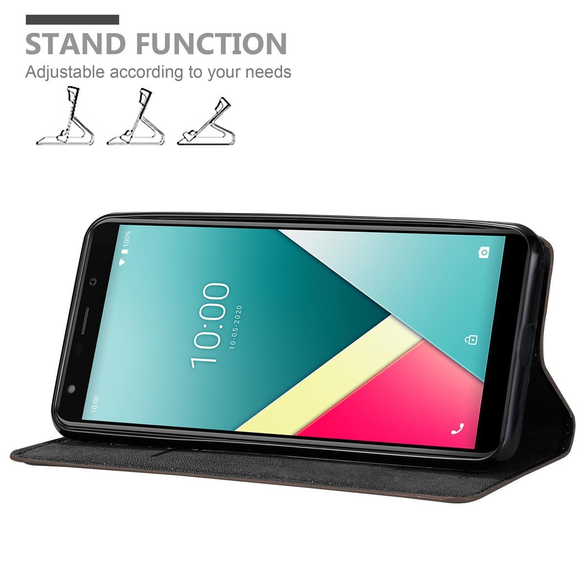 Funda de teléfono negra con soporte. El teléfono está dentro, mostrando la hora.