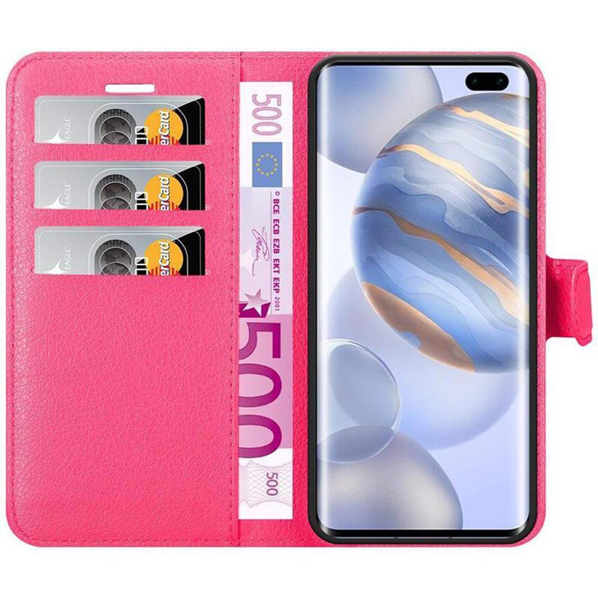 Custodia per telefono rosa con telefono all'interno. La custodia ha slot per carte e una banconota.
