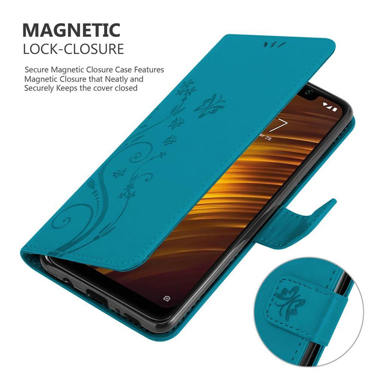 Custodia teal per telefono, aperta, che mostra un telefono con design floreale.