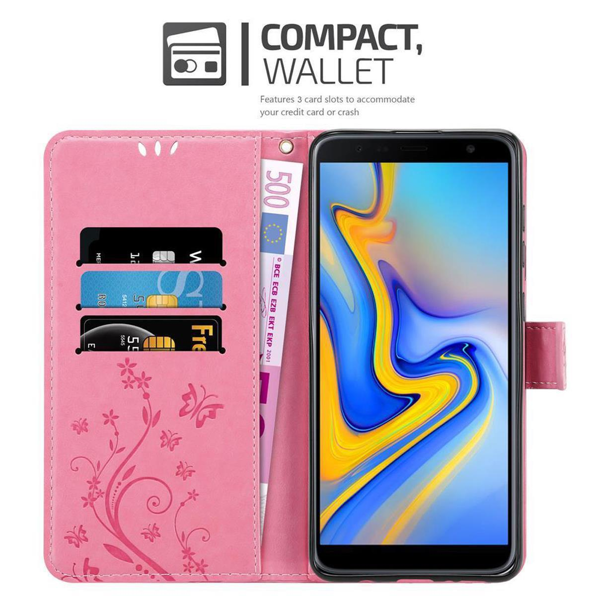 Custodia rosa aperta con telefono, slot per carte, carte e denaro.