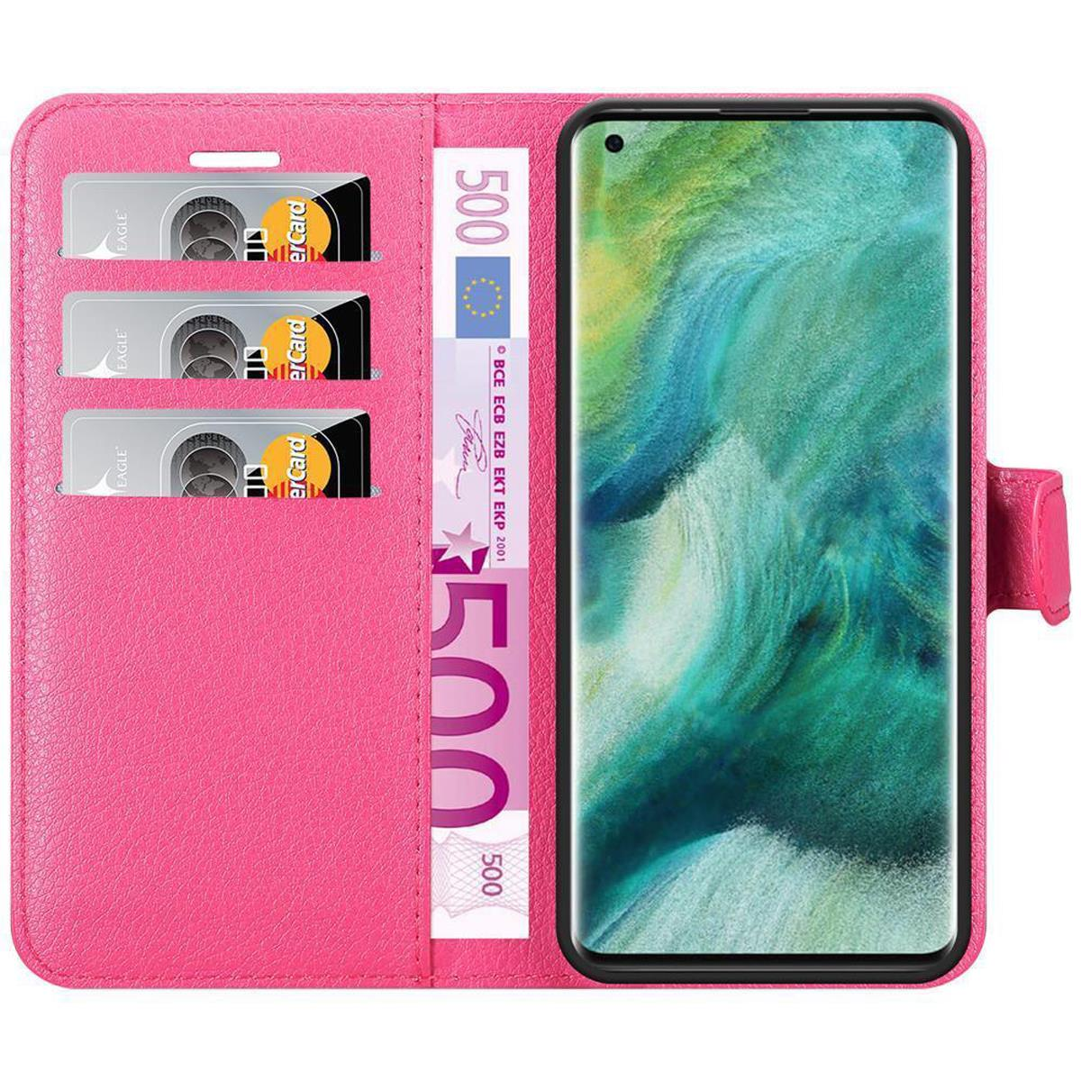 Una custodia rosa per telefono, aperta, con tre carte e un telefono all'interno.