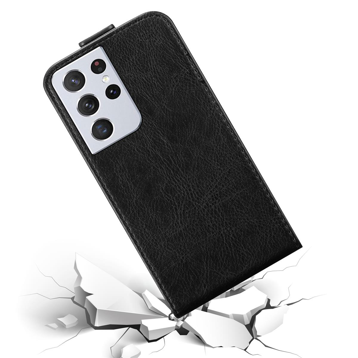 Custodia nera per telefono con obiettivi, che cade su superficie bianca incrinata.