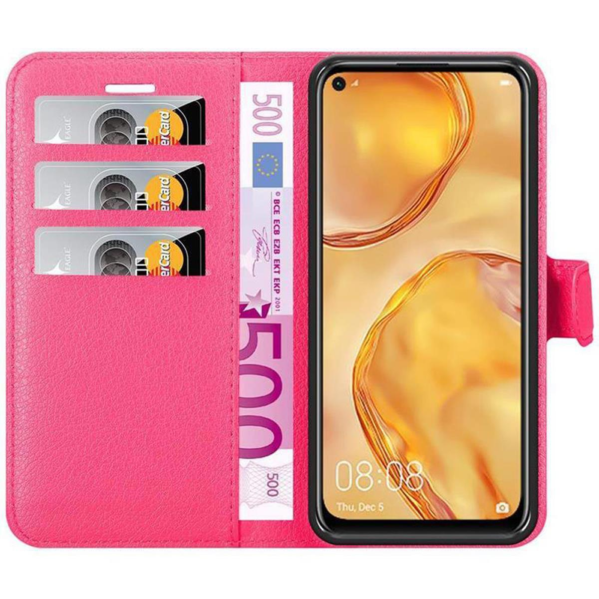 Custodia per telefono rosa, aperta, con telefono, denaro e fessure per carte. Il telefono è sul lato destro. La custodia è rosa.