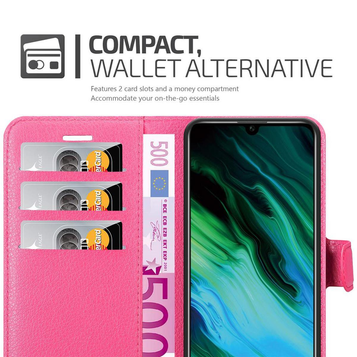 Custodia rosa per telefono con carte e denaro all'interno e un telefono a destra.